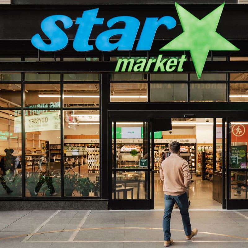 Man walking into Star Market entrance